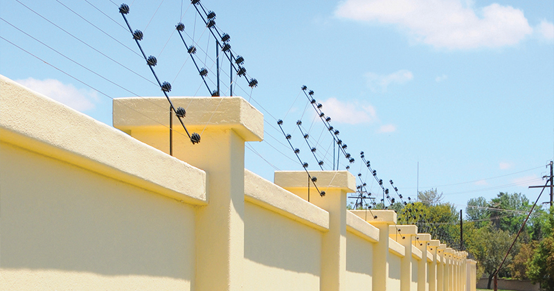 Electric security fence protects residential complex